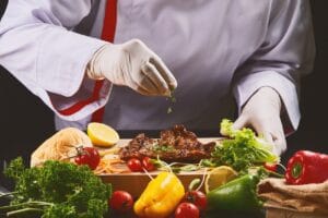 Gloved chef cooking restuarant